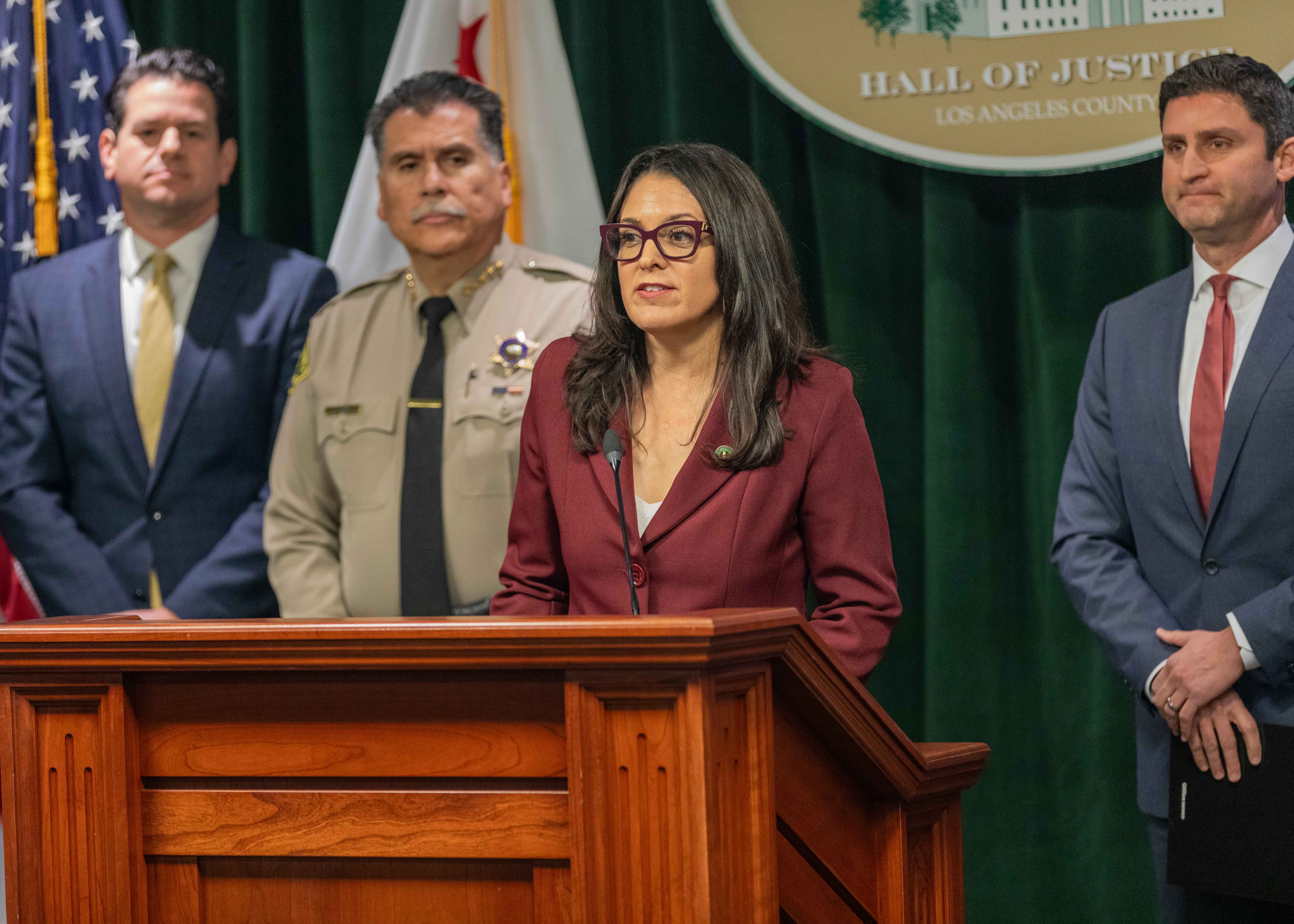 Assemblymember Pacheco speaking at the podium during a press conference. 